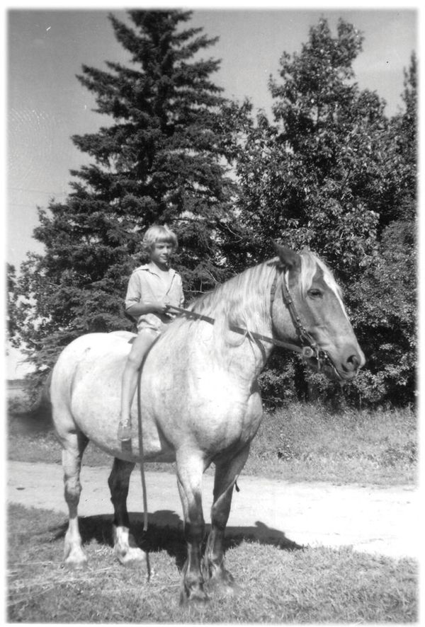 John and Mary Mitchell embodied the true spirit of the pioneers of Saskatchewan through their hard work, perseverance, and determination. John Walter Mitchell was born May 21, 1911 in Preeceville,
Saskatchewan, John and his wife, Gladys Mary Norman, devoted their lives to this farm. The homestead remained in the Mitchell family for 100 years. Gladys Mary Mitchell (nee Norman) was born December 6, 1915 in Stranraer, Sask. Mary was very experienced working with 2, 3, 4, 5, 6 and 8 horse hooks doing fieldwork, seeding, and haying. Mary’s move to Preeceville from Stranraer, Saskatchewan was another historical and memorable event for the area. Mary loaded her new tractor and her
favorite team of Clydesdale cross mares in one CN boxcar and a very select, high quality herd of twelve Shorthorn cattle in another. They arrived at Buchanan, Saskatchewan and she drove her tractor and led her team the 22 miles from Buchanan to the Mitchell farm south of
Preeceville. The cattle were transported by truck.
Muriel and Bonnie, Bonnie was one of the mares that Mom brought with her on the train when she married Dad. Muriel Mitchell Saskatchewan